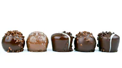 line of chocolates against a white background