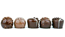 line of chocolates against a white background