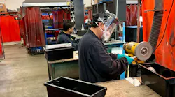 LB Foster Joemar Fortaleza bends inserts while co-worker Jose Zurbito deburs them on the soft wheel bench grinder.
