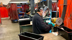 LB Foster Joemar Fortaleza bends inserts while co-worker Jose Zurbito deburs them on the soft wheel bench grinder.